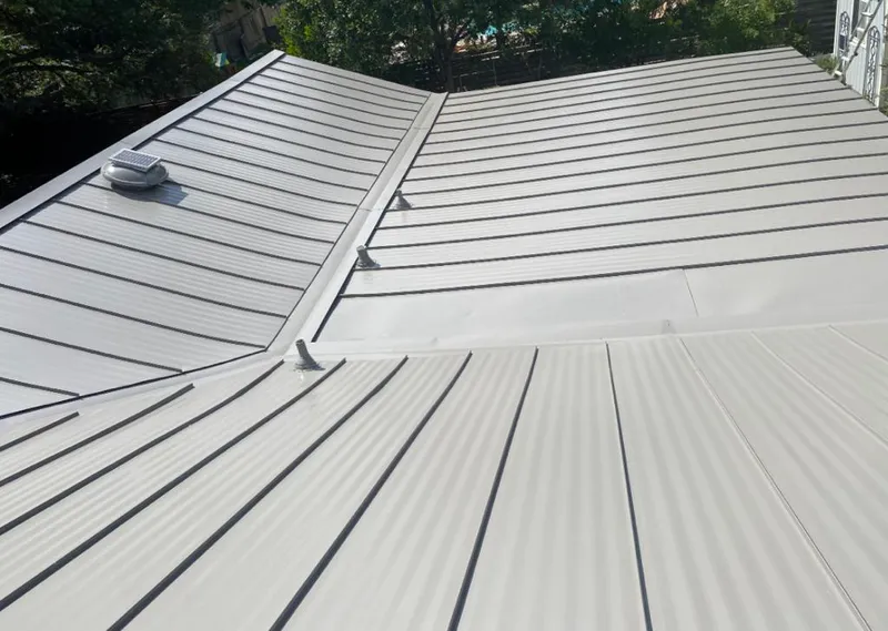 Solar attic fan installed on a metal roof for Roof Ventilation in Salmon Creek